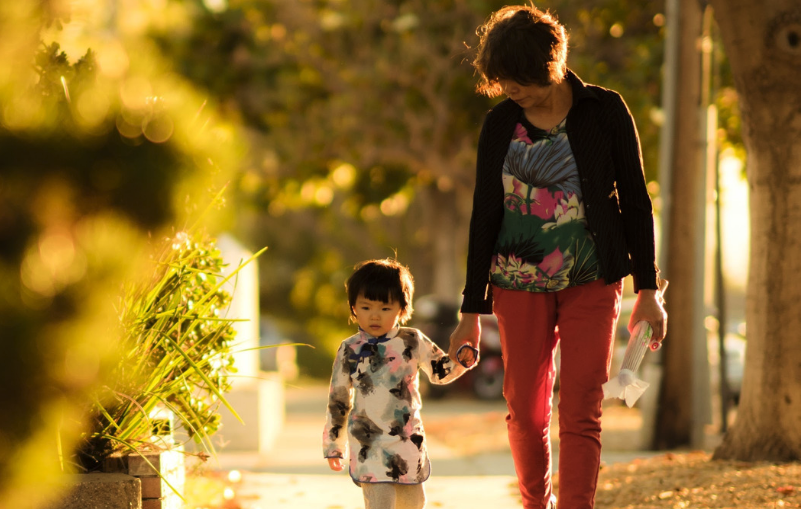 Woman walking with child