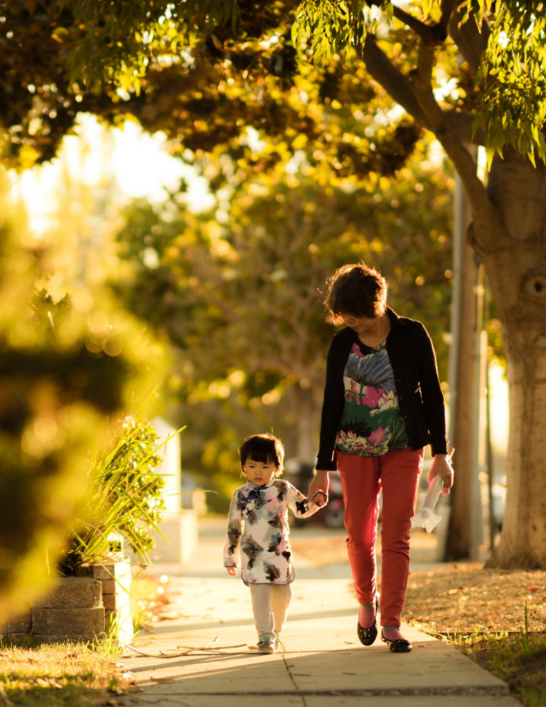 Woman walking with child